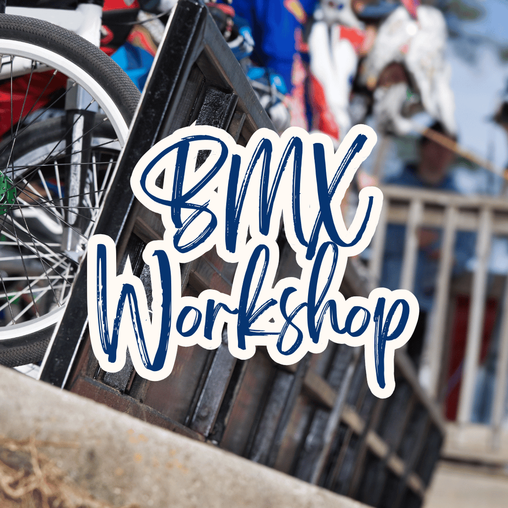 Bicycle with 'BMX Workshop' text overlay in an outdoor setting
