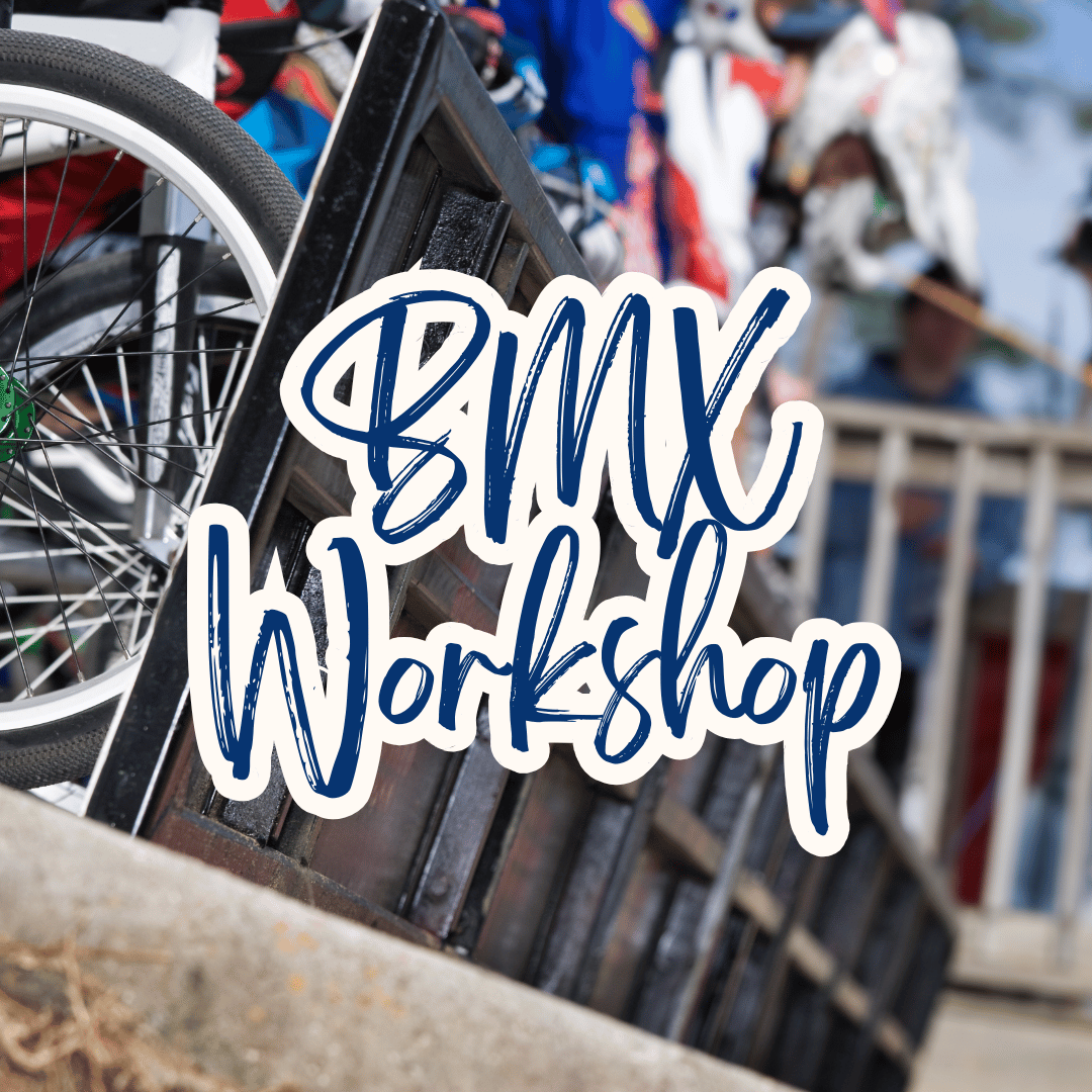 Bicycle with 'BMX Workshop' text overlay in an outdoor setting