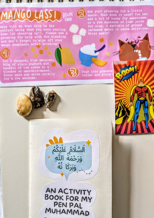 Activity book for a pen pal with stickers on a white surface