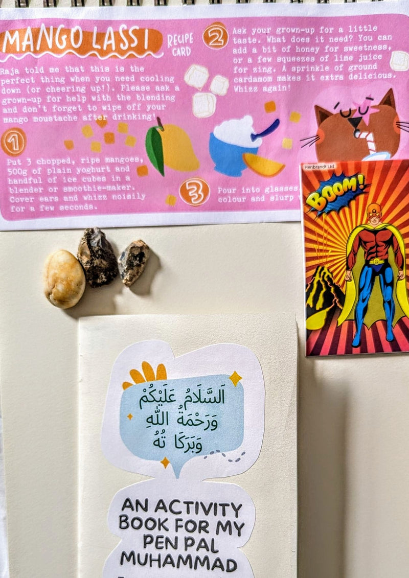 Activity book for a pen pal with stickers on a white surface